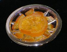 Oranges, preserved in an Elizabethan manner, presented on a silver and glass pedestal dish